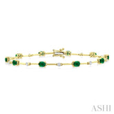 4x3 MM Oval Cut Emerald and 1/3 Ctw Round Cut Diamond Precious Bar Bracelet in 10K Yellow Gold