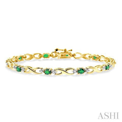 4x3 MM Oval Cut Emerald and 1/10 Ctw Single Cut Diamond Bracelet in 10K Yellow Gold 4x3 MM Oval Cut Emerald and 1/10 Ctw Single Cut Diamond Bracelet in 10K Yellow Gold