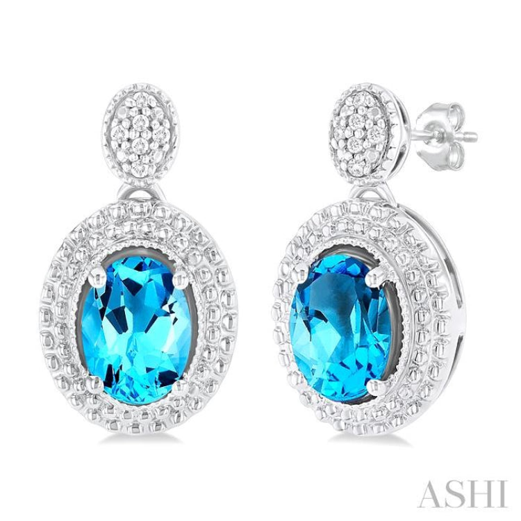 7X5 MM Oval Cut Blue Topaz and 1/20 ctw Round Cut Diamond Semi-Precious Earring in Sterling Silver 7X5 MM Oval Cut Blue Topaz and 1/20 ctw Round Cut Diamond Semi-Precious Earring in Sterling Silver