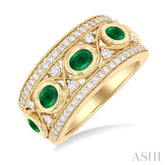 4x3 MM Oval and 2.8 MM Round Cut Emerald and 3/8 Ctw Curvy Criss Cross Single Cut Diamond Precious Band in 14K Yellow Gold