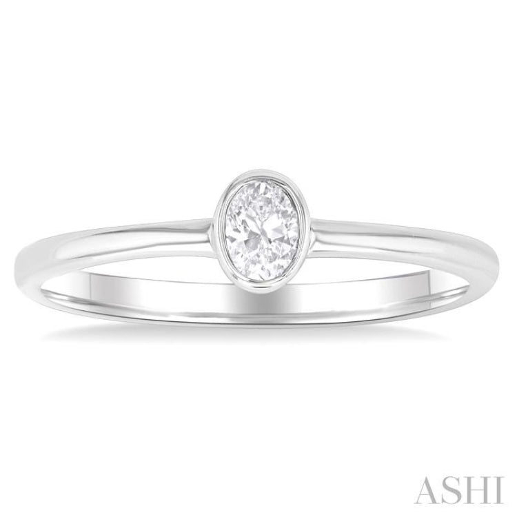 1/6 Ctw Petite Bezel Set Oval Cut Diamond Fashion Ring in 10K White Gold 1/6 Ctw Petite Bezel Set Oval Cut Diamond Fashion Ring in 10K White Gold