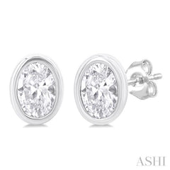 1/5 Ctw Petite Bezel Set Oval Cut Diamond Fashion Stud Earring in 10K White Gold 1/5 Ctw Petite Bezel Set Oval Cut Diamond Fashion Stud Earring in 10K White Gold