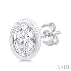 1/5 Ctw Petite Bezel Set Oval Cut Diamond Fashion Stud Earring in 10K White Gold 1/5 Ctw Petite Bezel Set Oval Cut Diamond Fashion Stud Earring in 10K White Gold