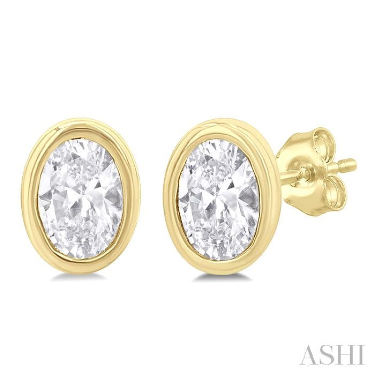 1/5 Ctw Petite Bezel Set Oval Cut Diamond Fashion Stud Earring in 10K Yellow Gold 1/5 Ctw Petite Bezel Set Oval Cut Diamond Fashion Stud Earring in 10K Yellow Gold
