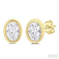 1/5 Ctw Petite Bezel Set Oval Cut Diamond Fashion Stud Earring in 10K Yellow Gold 1/5 Ctw Petite Bezel Set Oval Cut Diamond Fashion Stud Earring in 10K Yellow Gold