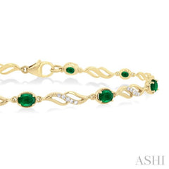 4X3 MM Oval Cut Emerald and 1/5 Ctw Round Cut Diamond Precious Eternity Link Tennis Bracelet in 10K Yellow Gold 4X3 MM Oval Cut Emerald and 1/5 Ctw Round Cut Diamond Precious Eternity Link Tennis Bracelet in 10K Yellow Gold
