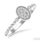 1/8 Ctw Petite Bead Shank Oval Center Round Cut Diamond Fashion Ring in 10K White Gold