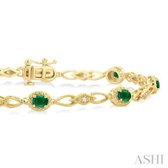 1/20 Ctw Oval Cut 4X3MM Emerald and Round Cut Diamond Precious Fashion Bracelet in 10K Yellow Gold 1/20 Ctw Oval Cut 4X3MM Emerald and Round Cut Diamond Precious Fashion Bracelet in 10K Yellow Gold