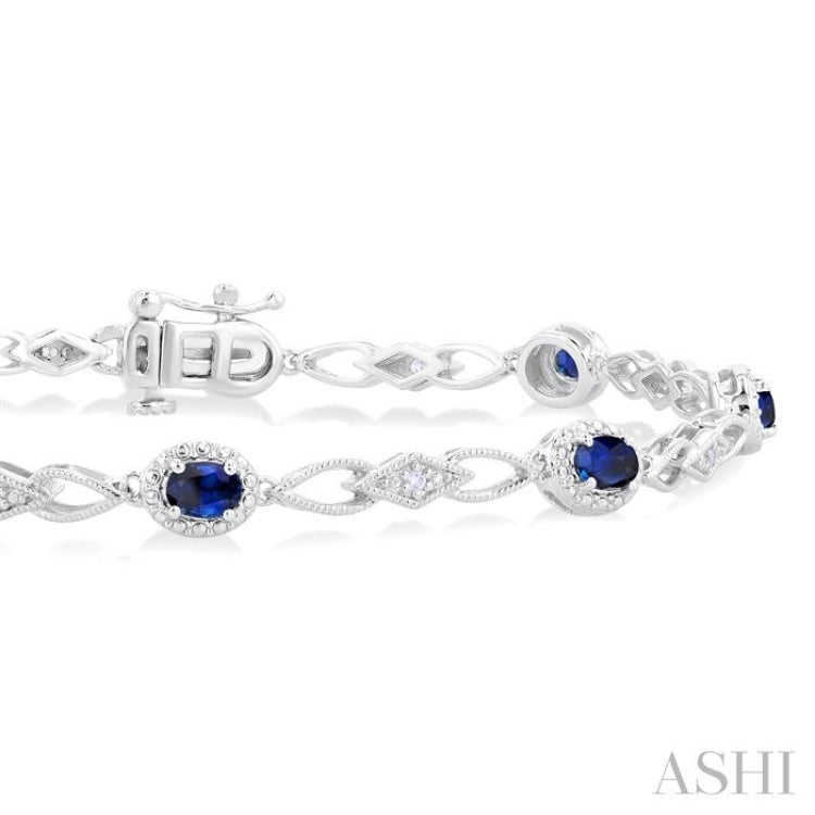 1/20 Ctw Oval Cut 4X3MM Sapphire and Round Cut Diamond Precious Fashion Bracelet in 10K White Gold 1/20 Ctw Oval Cut 4X3MM Sapphire and Round Cut Diamond Precious Fashion Bracelet in 10K White Gold