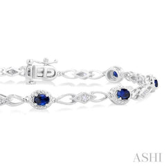 1/20 Ctw Oval Cut 4X3MM Sapphire and Round Cut Diamond Precious Fashion Bracelet in 10K White Gold 1/20 Ctw Oval Cut 4X3MM Sapphire and Round Cut Diamond Precious Fashion Bracelet in 10K White Gold