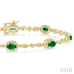 5x3 MM Oval Cut Emerald and 1/20 Ctw Single Cut Diamond Bracelet in 10K Yellow Gold 5x3 MM Oval Cut Emerald and 1/20 Ctw Single Cut Diamond Bracelet in 10K Yellow Gold