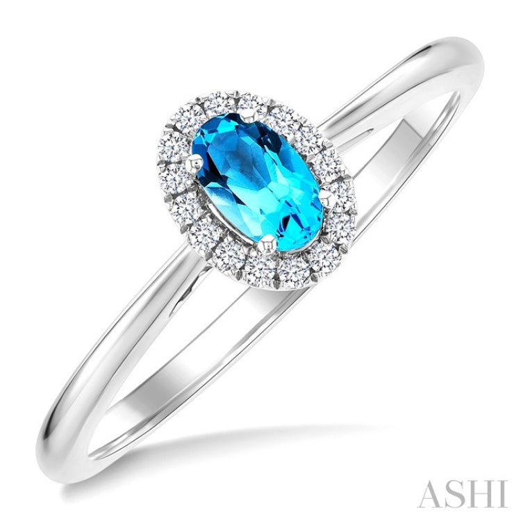 5x3 MM Oval Shape Blue Topaz and 1/20 Ctw Round Cut Diamond Halo Semi-Precious Ring in 14K White Gold