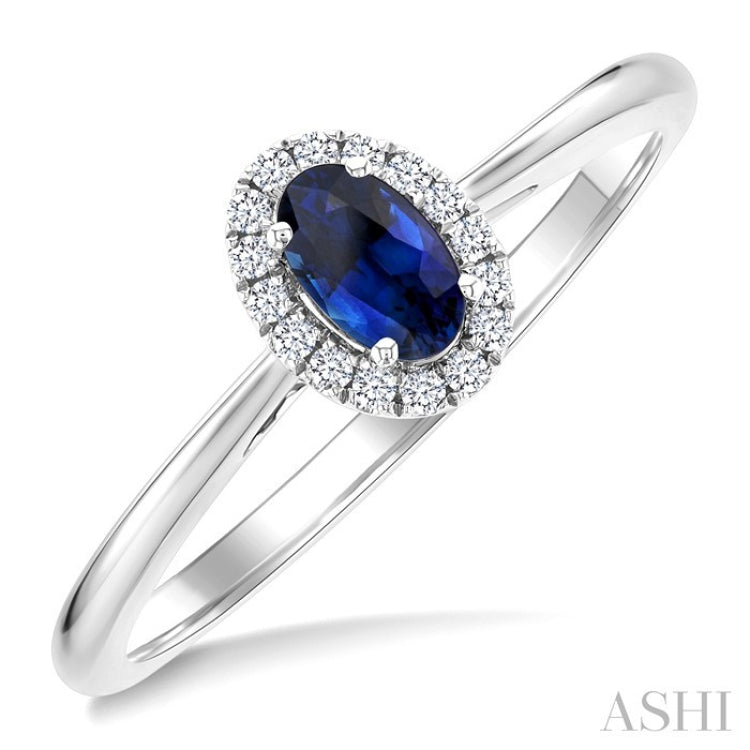 5x3 MM Oval Shape Sapphire and 1/20 Ctw Round Cut Diamond Halo Precious Ring in 10K White Gold
