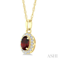 5x3 MM Oval Shape Garnet and 1/20 Ctw Round Cut Diamond Halo Semi-Precious Pendant with Chain in 10K Yellow Gold