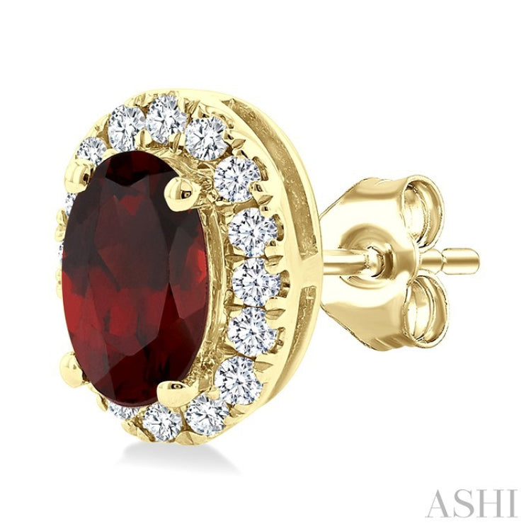 5x3 MM Oval Shape Garnet and 1/8 Ctw Round Cut Diamond Halo Semi-Precious Stud Earrings in 14K Yellow Gold