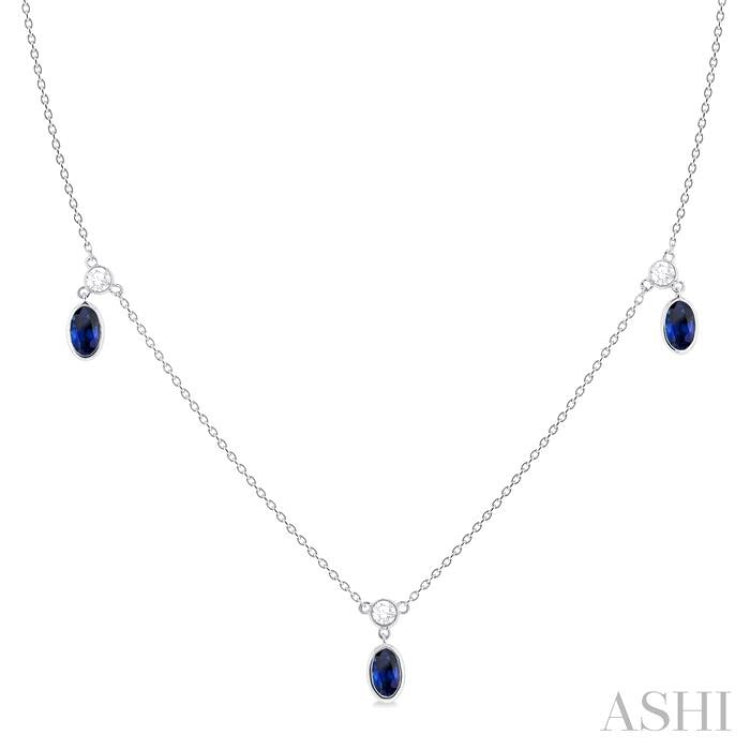 5x3 MM Oval Shape Sapphire and 1/8 Ctw Round Cut Diamonds Precious Station Necklace in 10K White Gold