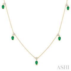 5x3 MM Oval Shape Emerald and 1/8 Ctw Round Cut Diamonds Precious Station Necklace in 10K Yellow Gold