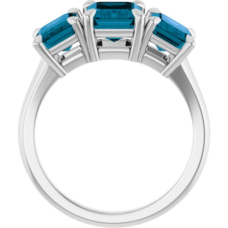 Platinum 8x6 mm Emerald Natural London Blue Topaz Three-Stone Ring