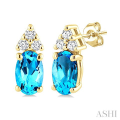 1/20 Ctw Oval Cut 5X3 MM Blue Topaz and Round Cut Diamond semi-precious Earrings in 10K Yellow Gold