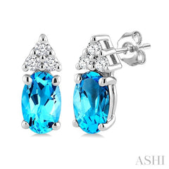 1/20 Ctw Oval Cut 5X3 MM Blue Topaz and Round Cut Diamond semi-precious Earrings in 10K White Gold