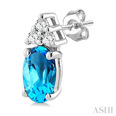 1/20 Ctw Oval Cut 5X3 MM Blue Topaz and Round Cut Diamond semi-precious Earrings in 10K White Gold