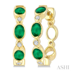 4X3 MM Oval Shape Emerald and 1/20 Ctw Bezel Set Round Cut Diamond Fashion Hoop Earrings in 10K Yellow Gold