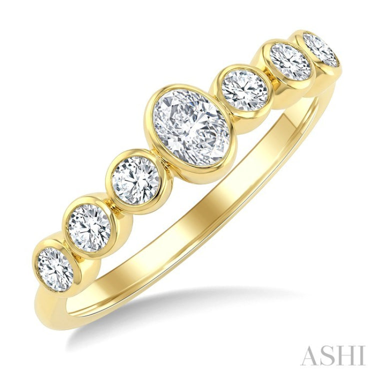 1/2 Ctw Bezel Set Oval and Round Cut Diamond Fashion Band in 14K Yellow Gold