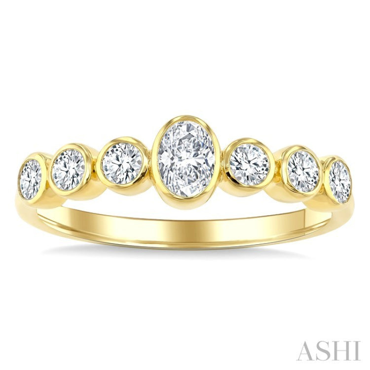 1/2 Ctw Bezel Set Oval and Round Cut Diamond Fashion Band in 14K Yellow Gold