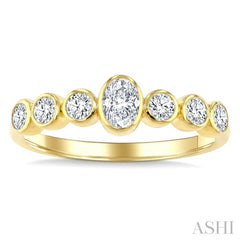 1/2 Ctw Bezel Set Oval and Round Cut Diamond Fashion Band in 14K Yellow Gold