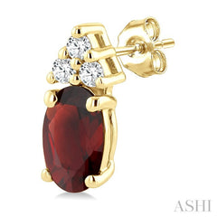 1/20 Ctw Oval Cut 5X3 MM Garnet and Round Cut Diamond semi-precious Earrings in 10K Yellow Gold