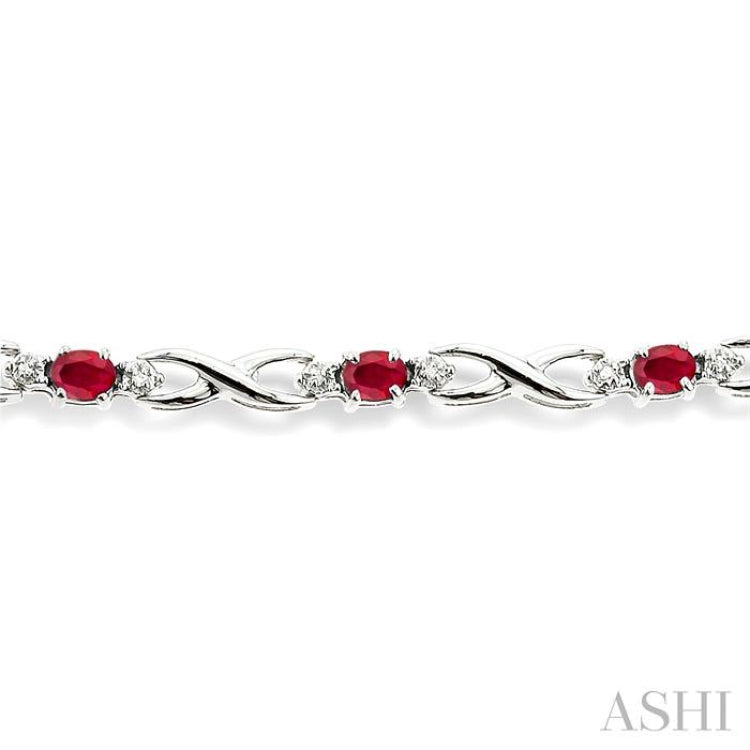 4x3 MM Oval Cut Ruby and 1/10 ctw Single Cut Diamond Bracelet in 10K White Gold