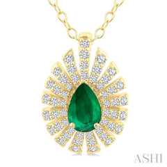 1/3 Ctw Starburst 6X4MM Pear Cut Emerald and Round Cut Diamond Precious Pendant With Chain in 14K Yellow Gold